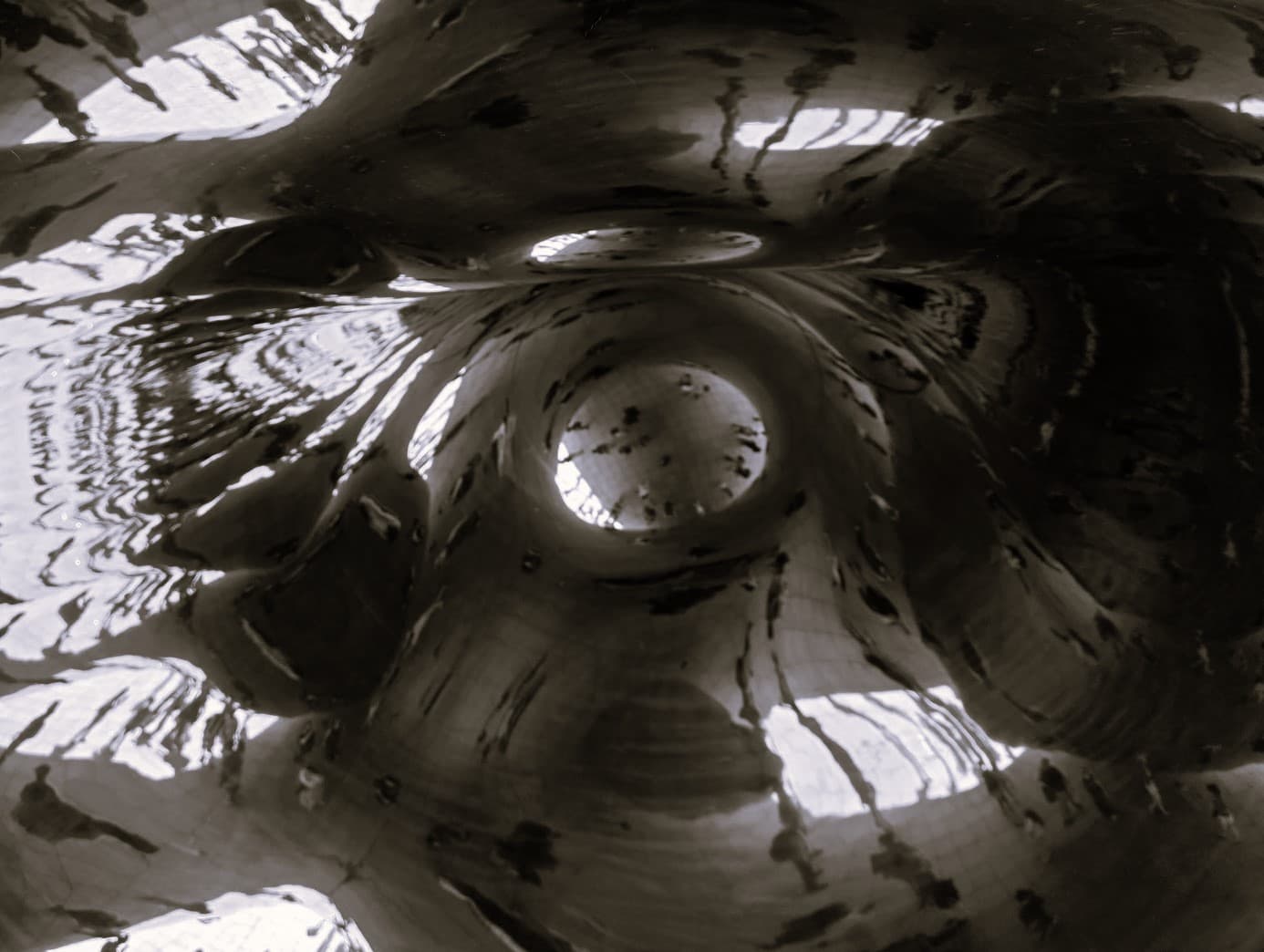 An artistically distorted photo of a group of people from above